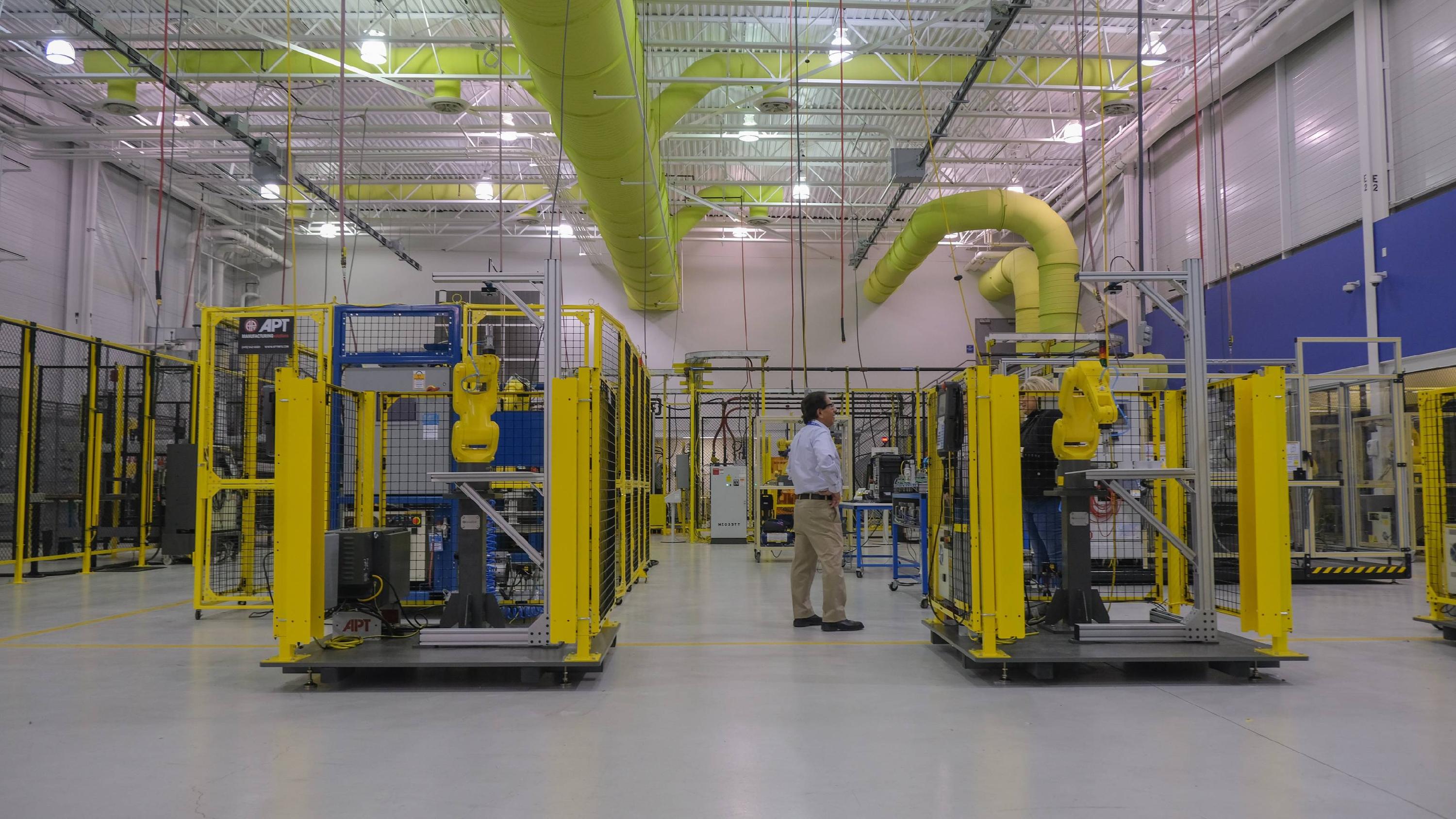 man standing in manufacturing facility